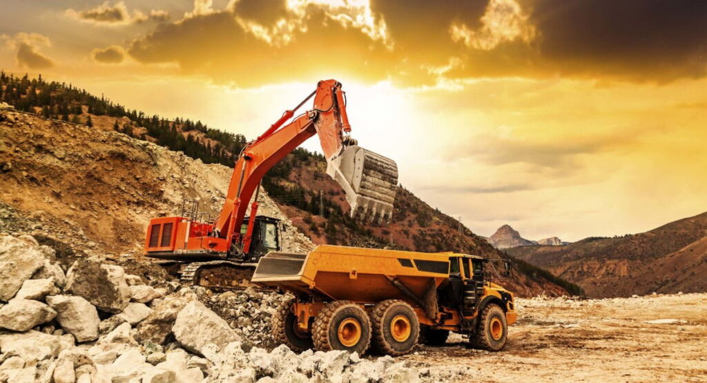 Open-pit mining operations in South Africa, where heavy machinery extracts mineral resources.