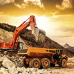 Open-pit mining operations in South Africa, where heavy machinery extracts mineral resources.