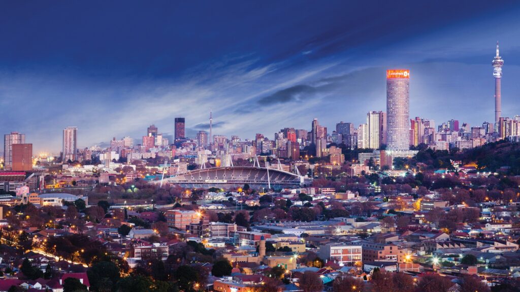 Evening skyline of Johannesburg, South Africa, showcasing the city’s financial district and urban landscape.