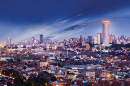 Evening skyline of Johannesburg, South Africa, showcasing the city’s financial district and urban landscape.