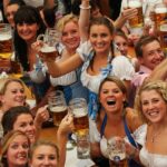 Revelers raise beer steins during Oktoberfest celebrations.