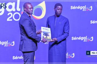 Officials present the Senegal 2050 development plan to the president at the Fii Senegal Investment Forum in Dakar