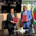 ICIEC and Afreximbank officials shake hands in Cairo, marking new partnership to boost Arab–Africa trade and digital finance platforms