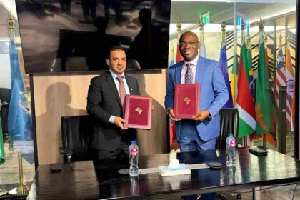 ICIEC and Afreximbank officials shake hands in Cairo, marking new partnership to boost Arab–Africa trade and digital finance platforms