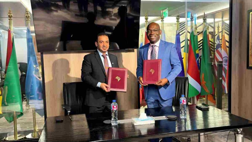 ICIEC and Afreximbank officials shake hands in Cairo, marking new partnership to boost Arab–Africa trade and digital finance platforms