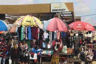Shoppers browse racks of second-hand clothing at Lagos’s Katangua market, a major hub for used apparel.