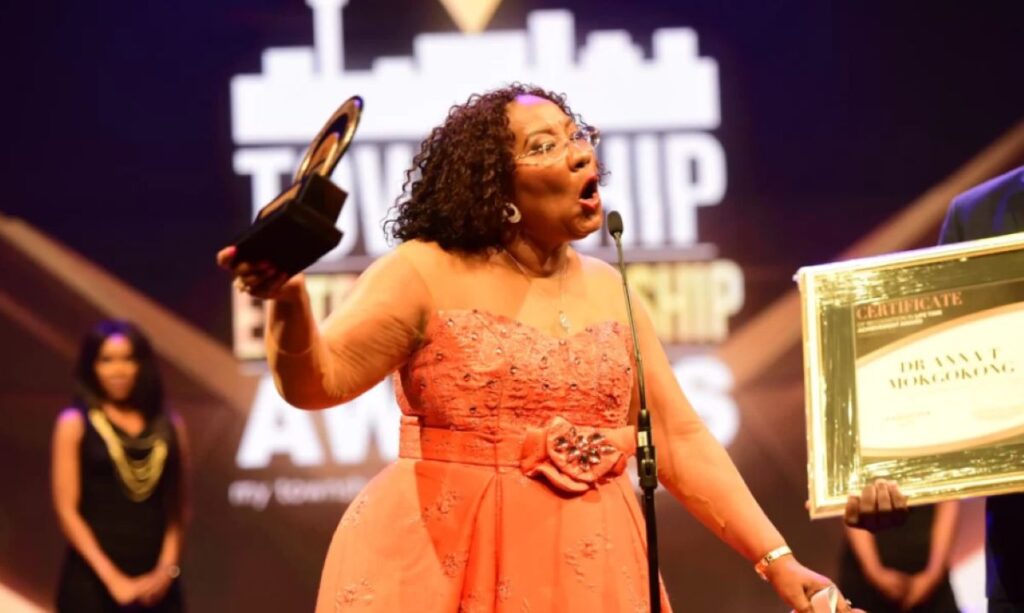 Anna Mokgokong addresses the audience after receiving an Entrepreneurship Award for her leadership at CIH and contributions to African business.