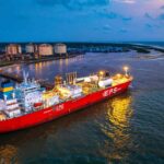 Nigeria LNG Ltd. (NLNG) plans to start operations at its $10 billion Train 7 project by the end of 2027, as the liquefied natural gas producer works to expand output and address persistent constraints on gas supply. Managing Director Adeleye Falade disclosed the target to reporters on the sidelines of the Gastech conference in Bangkok. The project, located on Bonny Island in Nigeria, is designed to increase NLNG’s production capacity to 30 million metric tons a year from 22 million metric tons. Train 7 has faced repeated delays, including setbacks linked to the COVID-19 pandemic and the war in Ukraine. The latest target puts the project on a path toward completion as Nigeria seeks to increase its LNG production capacity. Gas supply remains key constraint NLNG remains under a force majeure declared in 2022 after widespread flooding disrupted its gas supply, Falade said at the conference. The company expects to lift the force majeure once plant utilization reaches 90 percent. NLNG is currently operating at between 82 percent and 83 percent utilization, according to Falade. “We still have a delta of about 15 percent that we need to close,” he said. “Operationally, we are able to do that, but our biggest constraint is gas supply, and we're working with all the relevant people, including the government, to be able to get more gas to flow into the plant.” The comments highlight the importance of securing additional feed gas as NLNG works to raise production and meet its existing commitments. The company is focused on fulfilling its contractual obligations to buyers while seeking to maximize available production, Falade said. Buyers seek more LNG Interest in additional LNG volumes and spot cargoes has increased following disruptions to exports through the Strait of Hormuz during the Iran war, Falade said. “People are looking at more diversified, reliable sources of supply,” he said. The increased interest comes as buyers seek alternative sources of LNG amid disruptions affecting established supply routes. For NLNG, the priority remains its existing customer commitments while making use of additional production capacity where available. “Our priority currently is to continue to make sure that we fulfil our obligations to our existing customers and maximize as much production opportunity as possible that we have,” Falade said. Ownership and expansion NLNG is majority-owned by the Nigerian National Petroleum Company, with foreign partners including Shell, TotalEnergies and Eni. The Train 7 expansion is expected to raise the company’s nameplate capacity by 8 million metric tons a year, taking total capacity from 22 million metric tons to 30 million metric tons. For NLNG, the expansion comes alongside efforts to improve utilization at its existing facilities. The company’s ability to increase output remains tied to the availability of sufficient gas supplies, according to Falade. The end-2027 startup target therefore places both the completion of Train 7 and continued improvement in gas supply at the center of NLNG’s plans to increase LNG production.
