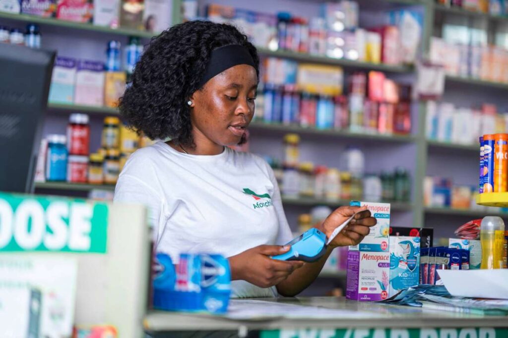 Shop owner generating a receipt using Moniepoint POS machine for daily business transactions.