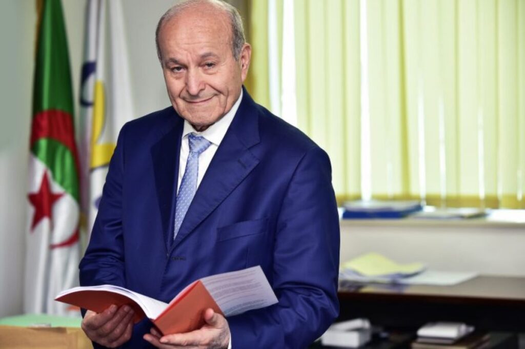 Issad Rebrab at his office reading, showcasing his passion for learning.