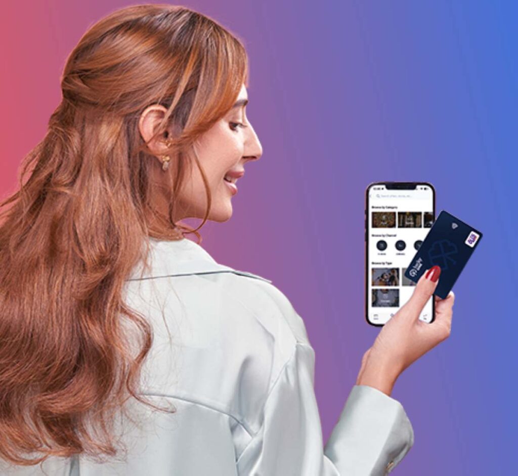 Customer holding Lucky card and using Lucky app in Egypt.