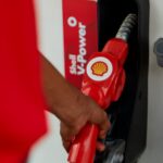 Shell logo on a fuel nozzle at a retail station.