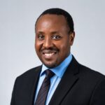Allan Kilavuka, immediate former Group Managing Director and CEO of Kenya Airways, in an official executive portrait.