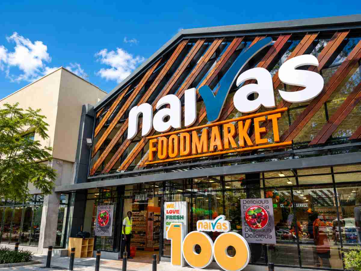 Naivas supermarket exterior featuring storefront branding, customer entrance, and modern retail expansion in Kenya.